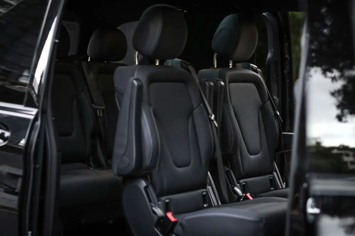 Passenger seats inside a black executive van